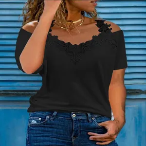 Detail of the elegant lace V-neckline and cold-shoulder design on a black T-shirt