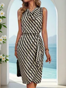 Full body view of a sleeveless dress with black and white wavy stripes in a scenic setting.