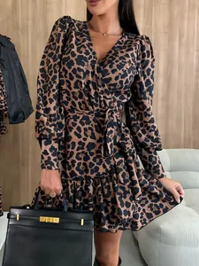 Elegant leopard print mini dress with puff sleeves and V-neck tie waist detail