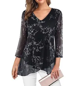 Detail view of a floral V-neck pullover with sheer sleeves and asymmetrical layered hem