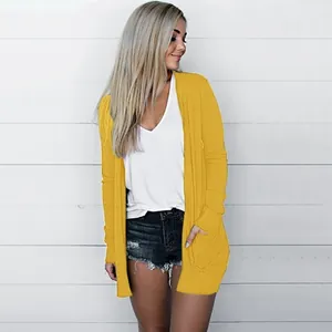 Lifestyle view of a model wearing a bright yellow casual open-front cardigan for women.