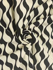 High-quality macro view of luxury black and white wavy stripe fabric pattern and texture