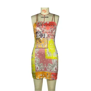 Detailed view of a slim fit camisole dress with vibrant paisley prints on a mannequin.