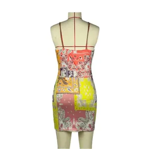 Detailed back view of a slim-fit camisole dress with colorful paisley patchwork print.