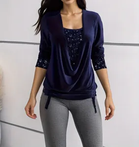 Detail view of navy blue cowl neck top with shimmering sequin inserts and sleeve cuffs
