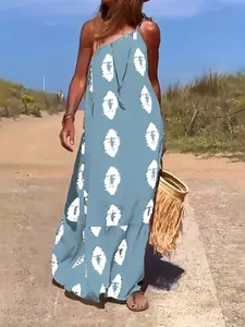 Elegant one-shoulder Bohemian print maxi dress with tie-string detail in a soft blue hue