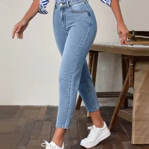 Close-up detail of women's classic retro high-waist stretch slim-fit blue jeans