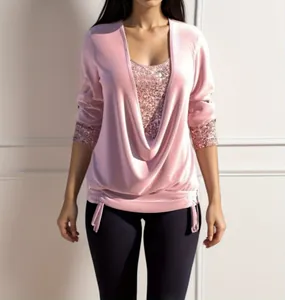 Detailed view of a pink sequin faux two-piece top featuring an elegant drape neckline
