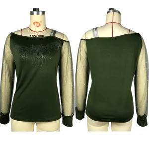 Front and back view of women's dark green long sleeve top with sparkly sequin mesh sleeves
