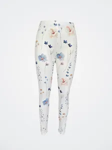 Detail of floral print leggings with delicate white lace trim at the ankles