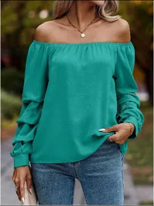 Detail shot of elegant teal off-the-shoulder long sleeve blouse for women's autumn fashion