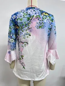 Back detail view of a floral print women's T-shirt with elegant pleated ruffle cuffs.