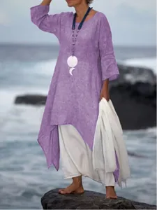 Loose purple long-sleeve cotton linen maxi dress with irregular hem in beach setting