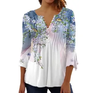 Elegant floral print V-neck blouse with pleated button detail and flared sleeves