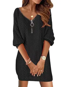 Detailed view of women's black V-neck cable knit dress featuring a front zipper closure.