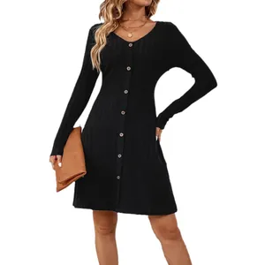 Elegant black long sleeve ribbed dress with button-front and waist-slimming design.