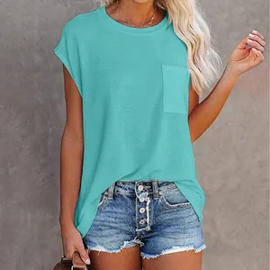 Casual women's teal round neck T-shirt with pocket detail paired with denim shorts
