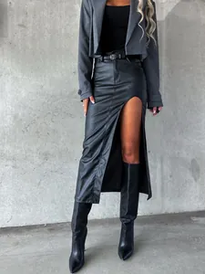 Stylish high-slit faux leather midi skirt for women in a chic urban outfit.