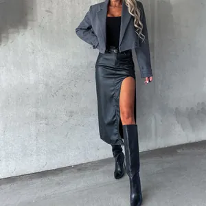 Sexy high-slit black faux leather midi skirt with a trendy cropped grey blazer