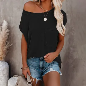 Detailed view of women's black off-shoulder t-shirt with a pocket and loose fit
