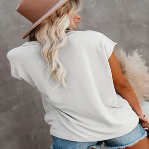 Rear view of a casual white round-neck T-shirt for women in a lifestyle setting.