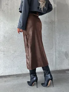 Detailed side view of a brown faux leather midi skirt with a sexy high slit for women