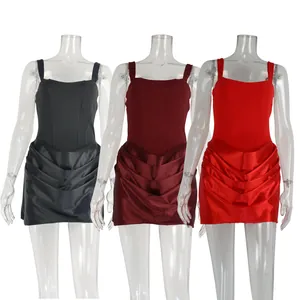 Detail view of trendy mini strap dresses in black, maroon, and red shown on mannequins