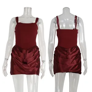 Front and back views of a burgundy spaghetti strap dress with a pleated satin skirt.