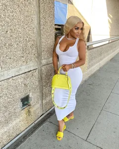 Detail view of a sexy white ribbed U-neck sleeveless bodycon maxi dress on a model