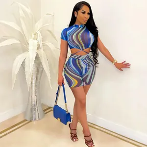 Detail view of women's two-piece set with colorful wavy print and tie-waist design