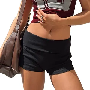Detailed view of slim-fit yoga shorts for women featuring a stylish fold-over waistband design.