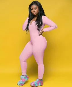 Pink long-sleeve loungewear jumpsuit with back butt flap on yellow background