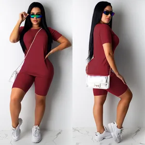 Detail view of women's maroon summer sports set with round neck T-shirt and biker shorts