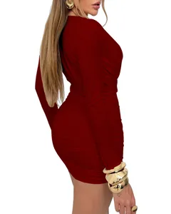 Side view of a sexy burgundy long sleeve ruched bodycon mini dress featuring side pleats
