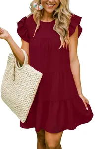 Wine red summer dress with ruffle sleeves and tiered pleated skirt on a model