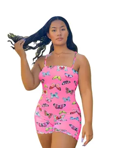 Detailed view of a pink romper featuring a vibrant multi-colored butterfly print