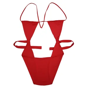 Flat lay view of a sexy red cutout monokini swimsuit with thin straps on white background