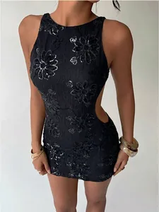 Detailed view of black lace embroidered sequined mini dress with a sexy backless design.