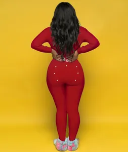 Back view of red long sleeve pajama jumpsuit with functional buttoned seat flap