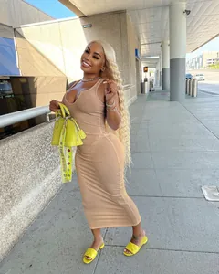 Close-up of a nude ribbed U-neck sleeveless bodycon midi dress worn by a model
