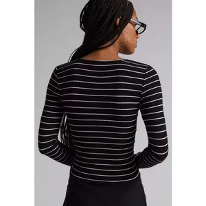 Close-up back view of a slim-fit black and white striped ribbed long sleeve top