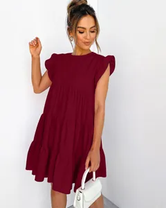 Front view of a burgundy tiered mini dress with ruffle sleeves and a tiered skirt