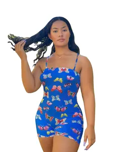 Detailed close-up showing the vibrant butterfly print pattern on a blue strappy romper jumpsuit