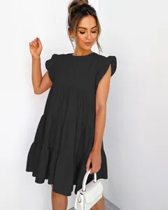 A detailed view of a stylish black ruffle sleeve tiered dress with elegant pleats