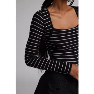 Close-up of black and white striped ribbed long sleeve top with square neckline