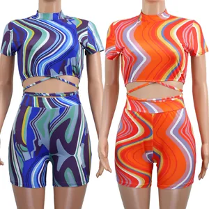Side-by-side comparison of two-piece summer outfits with vibrant wavy prints and waist ties