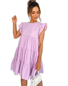 Close-up detail of lavender tiered dress featuring ruffle sleeves and pleated texture