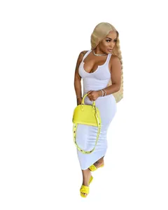 Detailed view of a white ribbed U-neck sleeveless bodycon maxi dress styled with yellow accessories