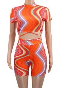 Front view of two-piece set featuring vibrant wavy print crop top and shorts.
