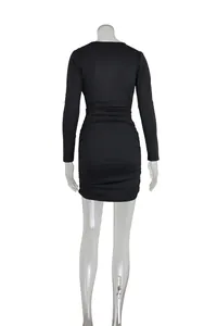 Rear view of a sexy black long-sleeved bodycon mini dress with elegant ruched detailing